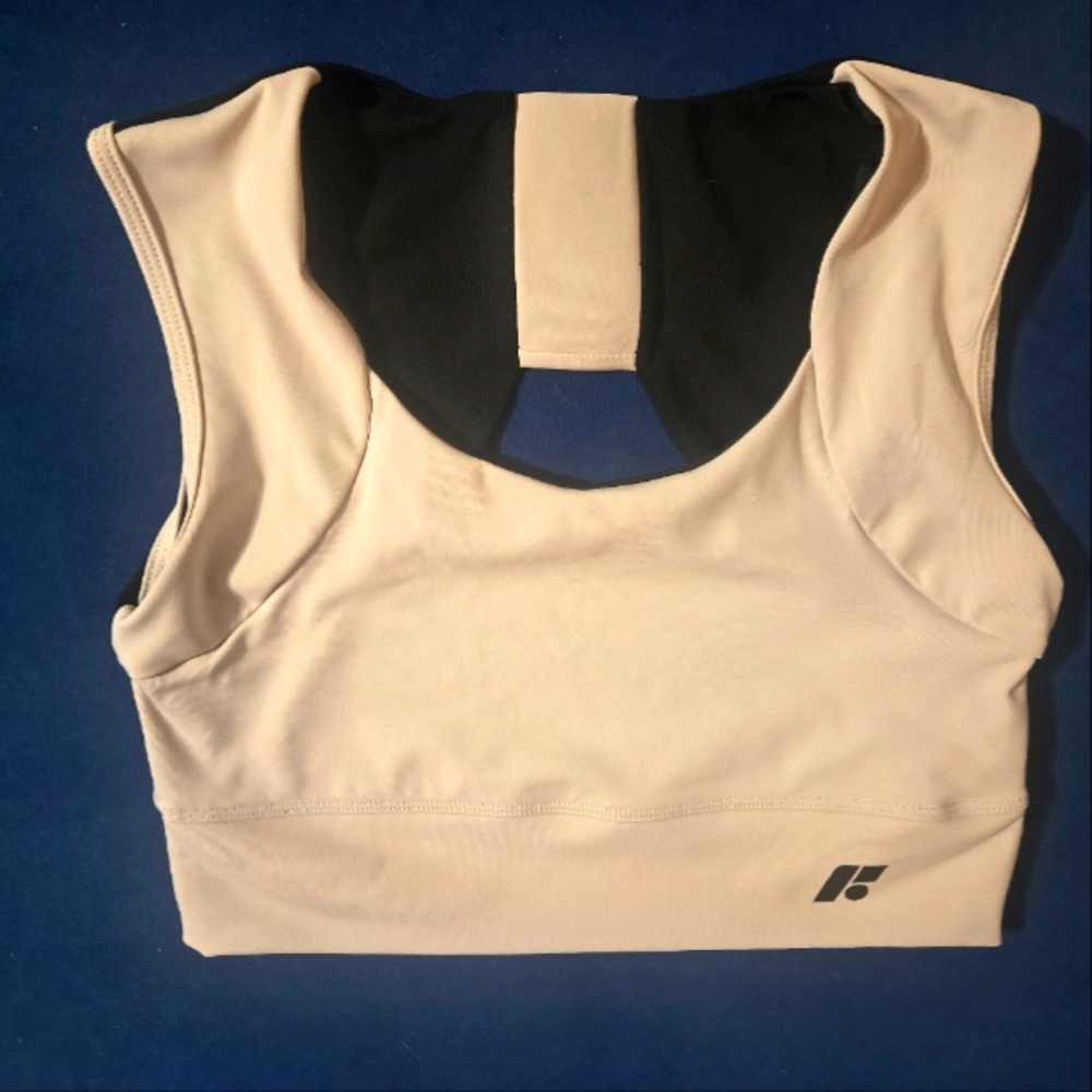 never worn creme & black with cutout in back, revive XL FORME sports bra.
